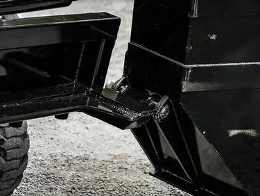 A close-up of a skid steer attached to the bucket.
